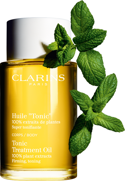 Bottle of Tonic Body Treatment Oil and a drop of oil