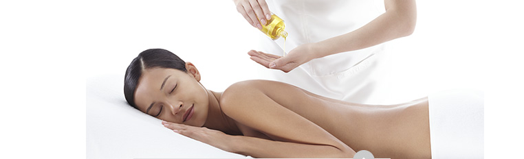 Woman receiving a spa back massage with Body Treatment Oil