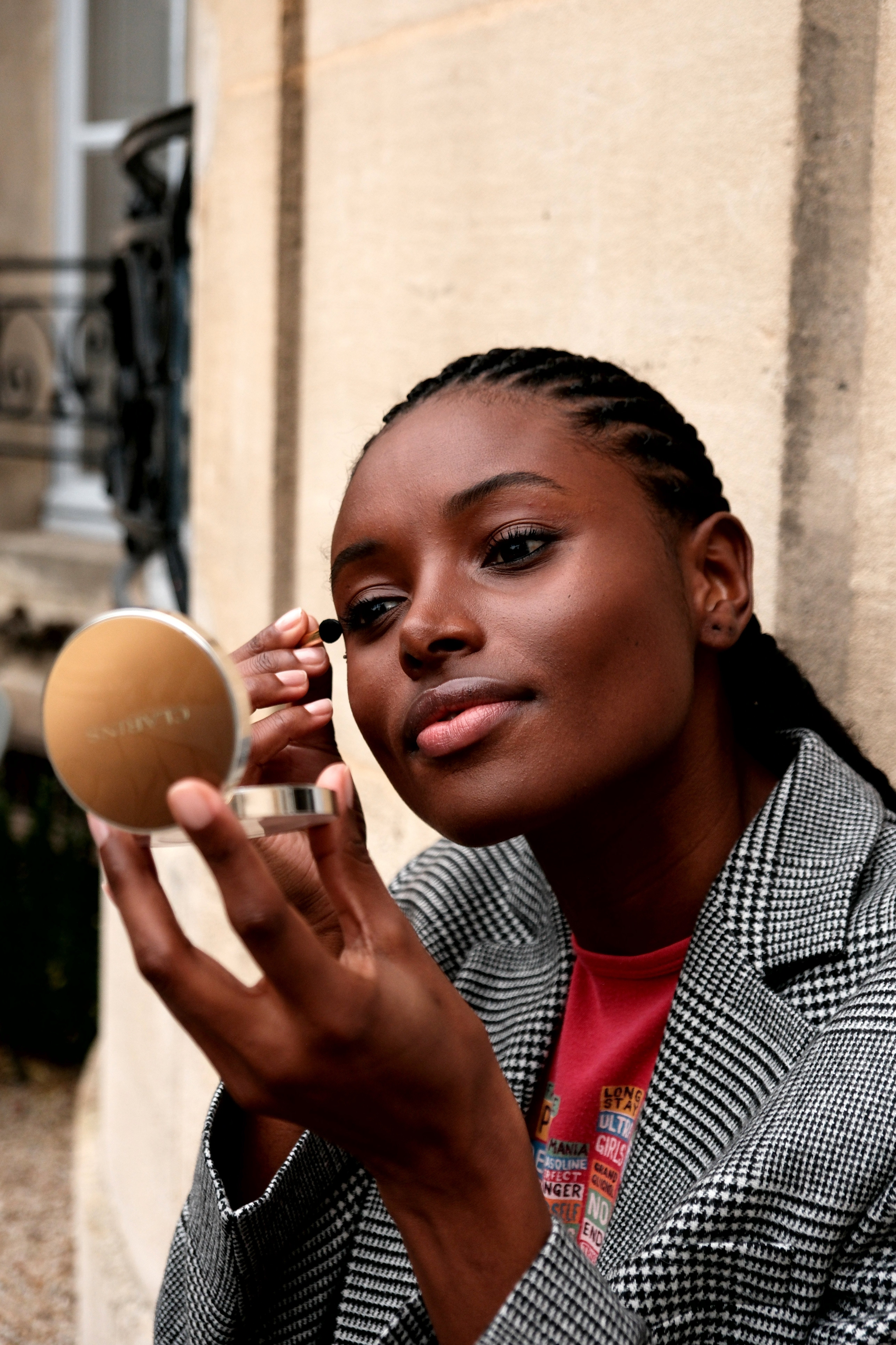 Woman applying eye makeup.