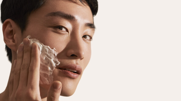 Man Using Skincare Product