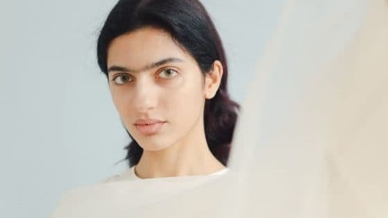 A woman with hazel eyes and thick lips looking at the camera A woman with hazel eyes and thick lips looking at the camera